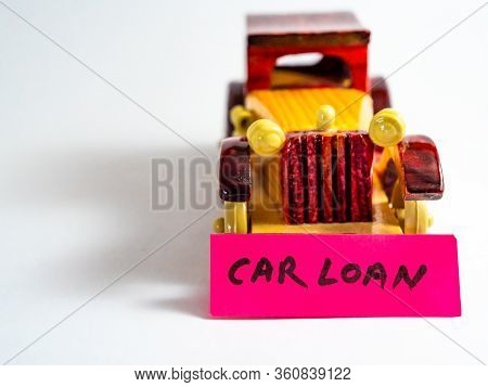 Close Up Shot Of A Vintage Toy Car With White Background And Copy Space For Loan Concept