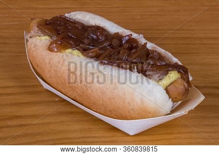 Chili Hot Dog Topped With Cheese And Sweet Onion