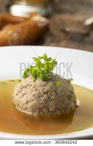 Bavarian Liver Dumpling Soup On Dark Wood