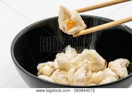 Jumbo Lump Of Fresh Crab Meat In Black Ceramic Bowl With Chopstick Placed On For Chinese Mood Isolat