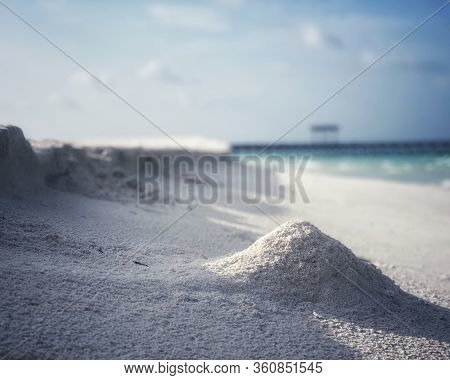White Sand Is On The Beach Near The Ocean