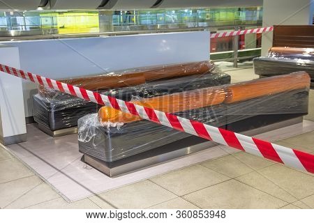 Closed Places Of A Public Catering Tables And Seats For People Are Fenced With A Restrictive Tape, A