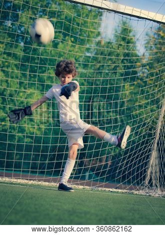 Summer Soccer Tournament For Young Kids. Football Club. Emotions And Joy Of The Game. Young Goalie. 