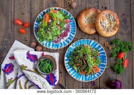 Georgian Salad With Nut Dressing On Blue Plate
