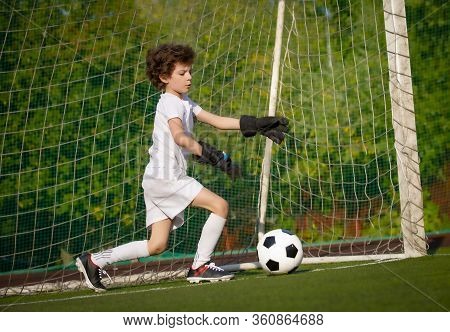 Summer Soccer Tournament For Young Kids. Football Club. Emotions And Joy Of The Game. Young Goalie. 