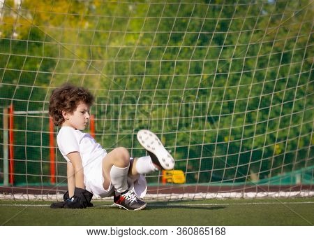 Summer Soccer Tournament For Young Kids. Football Club. Emotions And Joy Of The Game. Young Goalie. 