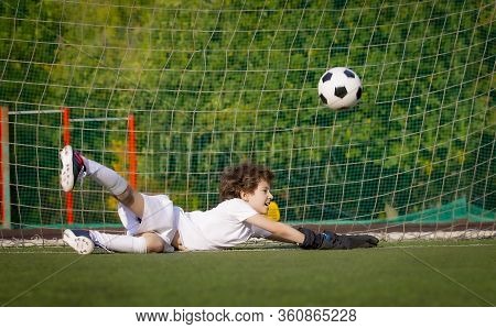 Summer Soccer Tournament For Young Kids. Football Club. Emotions And Joy Of The Game. Young Goalie. 