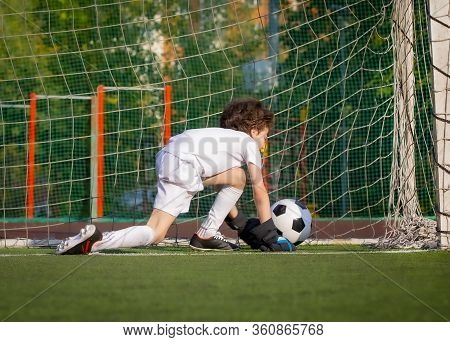Summer Soccer Tournament For Young Kids. Football Club. Emotions And Joy Of The Game. Young Goalie. 