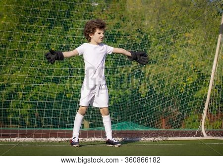 Summer Soccer Tournament For Young Kids. Football Club. Emotions And Joy Of The Game. Young Goalie. 