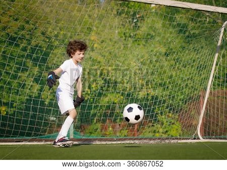 Summer Soccer Tournament For Young Kids. Football Club. Emotions And Joy Of The Game. Young Goalie. 