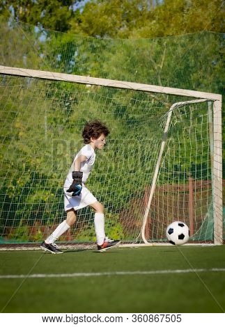 Summer Soccer Tournament For Young Kids. Football Club. Emotions And Joy Of The Game. Young Goalie. 