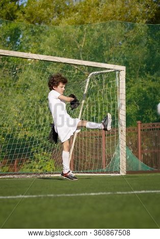 Summer Soccer Tournament For Young Kids. Football Club. Emotions And Joy Of The Game. Young Goalie. 
