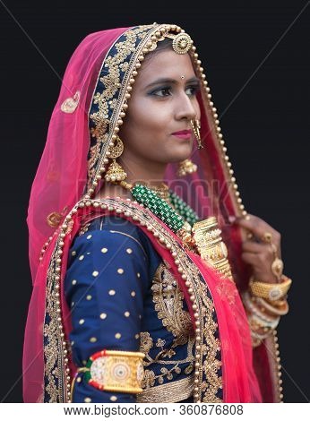 Bikaner, India - January 12, 2020: Indian Rajasthani Beautiful Girl In National Clothes Poses For A 