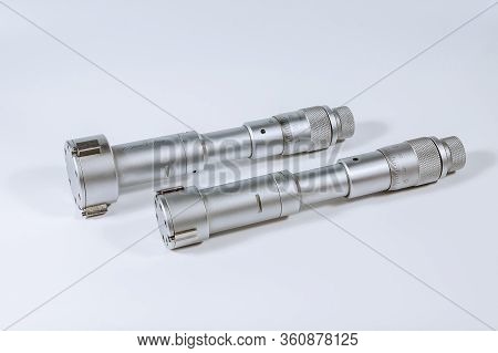Set Of Calibration Micrometers. Device For Accurately Measuring The Diameter Of The Hole, On A White