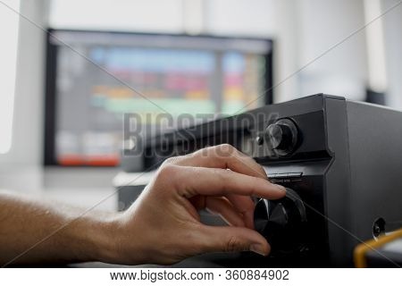 Clouse-up Male Music Arranger Works With Sound Amplifier He Is Composing Song On Midi Piano And Audi