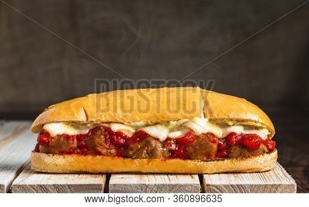 Meatball Sub With Steam On Wooden Surface