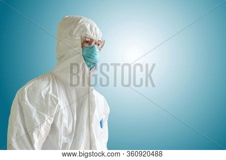 Medical Personnel In Half Protective Clothing Uniform Ppe Suit And Surgical Mask Or Hygienic Mask N9