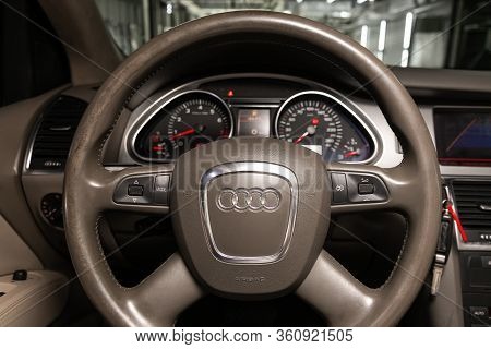 Novosibirsk/ Russia - April 02, 2020: Audi Q7, Auto Interior: Steering Wheel With Red Logo Audi   An
