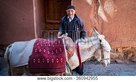 Abyaneh, Iran - May 2019: Old Man And His Donkey In The Traditional Village Of Abyaneh