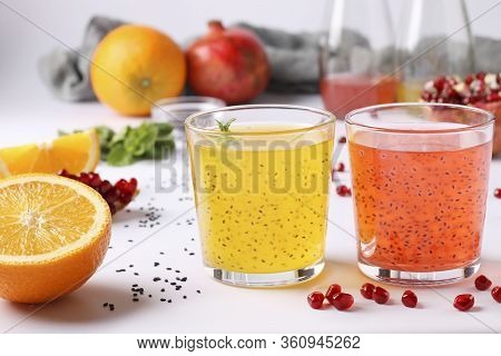 Tropical Orange And Pomegranate Juice With Basil Seeds Or Falooda Seeds Or Tukmaria In Glasses And B