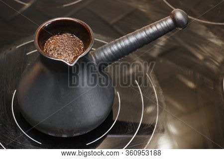 Karamic Turk With Coffee On An Electric Stove