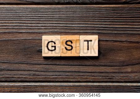 Gst Word Written On Wood Block. Gst Text On Wooden Table For Your Desing, Concept