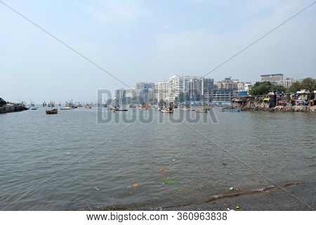 MUMBAI, INDIA - FEBRUARY 13, 2020: Fishing boats at Colaba fishing village, southern end of Mumbai city, India