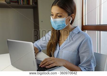 Covid-19 Pandemic Coronavirus Home Schooling E-learning Student Girl Mask Study From Home Laptop. Qu