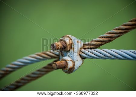 Steel Turnbuckle And Steel Sling Anchored Safety Net Into Concrete Block