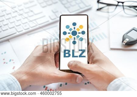 Logo Of Bluzelle Coin In Tablet. Cryptocurrency Blz Token. Trading Blockchain Platform To Buy,sell O