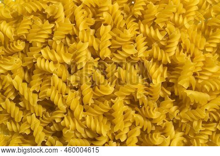 Background, Texture, Spiral Pasta. Spiral Pasta Close-up.
