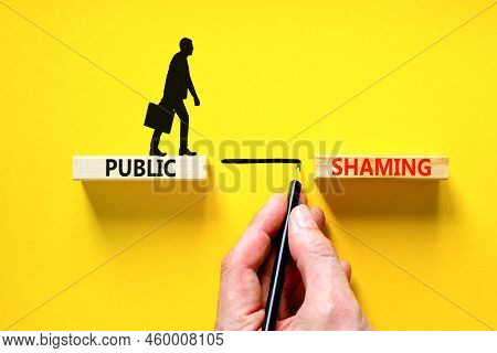 Public Shaming Symbol. Concept Words Public Shaming On Wooden Blocks On A Beautiful Yellow Table Yel