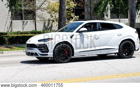 Miami Beach, Florida Usa - April 15, 2021: 2019 Giallo Auge Lamborghini Urus, Side View