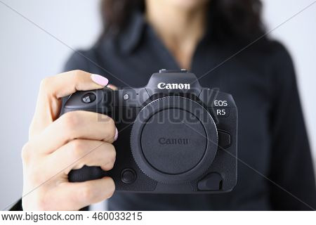 Tbilisi, Georgia - July 26, 2022: Person Holding Modern Canon Eos R5 Camera Closeup In Hand. Canon M