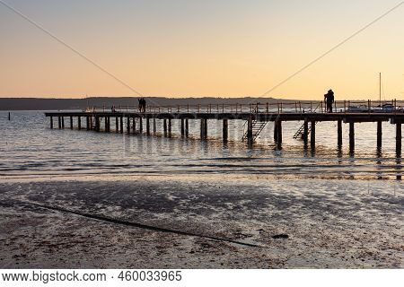 High Quality Photo Of A Pier At Sundown. Wooded Bridge Seaside With Sunset, Strunjan. Slovenia