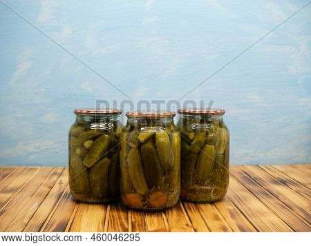 Preservations, Conservation. Salted, Pickled Cucumbers In A Jars On An Wooden Table. Pickling Cucumb