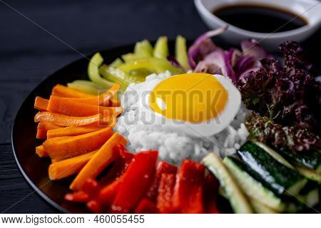 Close-up Of A Korean Dish, With A Variety Of Appetizers With Vegetables And Eggs. Diet. Bibimbap. To