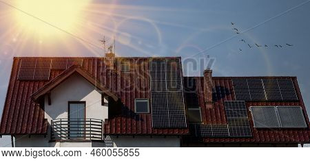 Solar Panels In The Sun On Large Roof. Solar Panel System For Home. Eco Friendly Power