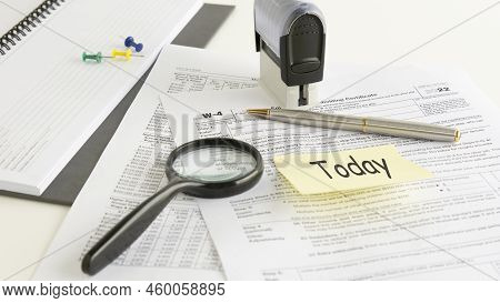 Blank W4 Tax Form, Magnifying Glass And A Pen On Table, Tax Season, Business Concept