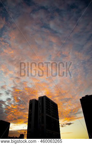 A Colorful Cirrostratus Sunset In The City