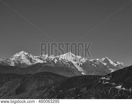 Rolling Snow Mountains Of Meili Range In Black And White
