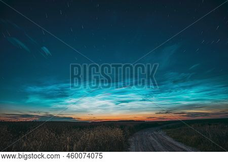 Amazing Rotate Stars Effect In Sky. Soft Colors. 6k Unusual Cloud And Stars Effects Above Countrysid