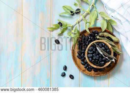 Raw Organic Vegetables. The Concept Of Vegan Or Diet Food. Fresh Ripe Black Soy Beans On A Wooden Ta