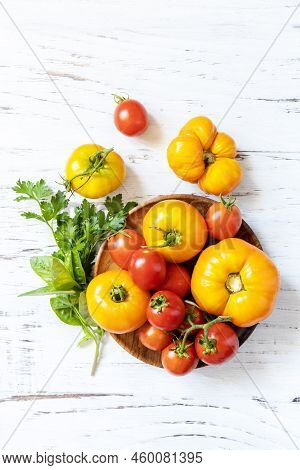 Raw Organic Vegetables. The Concept Of Vegan Or Diet Food. Fresh Ripe Bunch Colorful Tomatoes, Red,