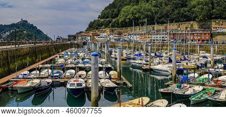 San Sebastian, Spain - June 26 2021: Panorama Withcolorful Fishing Boats On La Concha Bay With Monte