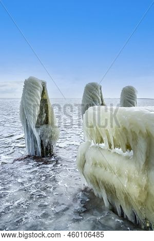 Den Oever, The Netherlands - February 10, 2021. Ice Build-up On The Piers Of The Afsluitdijk In The 