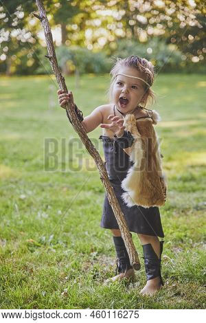 Cute Baby Dressed In The Clothes Of Primitive People