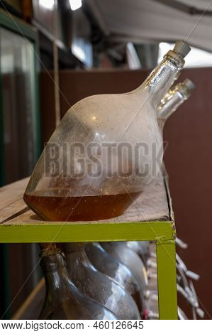 Big Bottles With White Wine Austrian Vinegar Made From Local Grapes On Market In Vienna, Austria