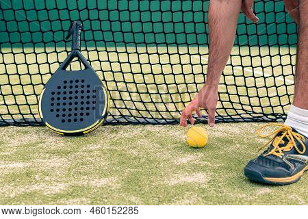 Monitor Of Padel Holding Yellow Ball Near Racket With Copy Space. Racquet Sport