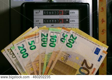Electricity Cost In European Countries. Euro Bills On Electric Meter Background. Rising Electricity 